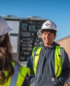 DMC technicians wearing safety vest on site